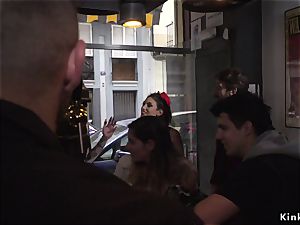Spanish babe takes bondage in public bar